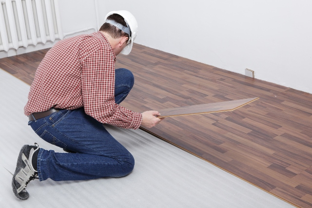 Laminate flooring with pad attached